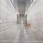 *"Fulgor Atlântico"* by Tiago Sant'Ana features an installation with the *Itutu* series in cobalt blue and a video exploring speech and listening. The works address themes of memory, identity, and Yoruba cultural traditions, connecting history, aesthetics, and Afro-diasporic resistance, highlighting the enduring influence of the African diaspora in Brazil.