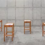 *"Fulgor Atlântico"* by Tiago Sant'Ana features an installation with the *Itutu* series in cobalt blue and a video exploring speech and listening. The works address themes of memory, identity, and Yoruba cultural traditions, connecting history, aesthetics, and Afro-diasporic resistance, highlighting the enduring influence of the African diaspora in Brazil.