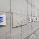 *"Fulgor Atlântico"* by Tiago Sant'Ana features an installation with the *Itutu* series in cobalt blue and a video exploring speech and listening. The works address themes of memory, identity, and Yoruba cultural traditions, connecting history, aesthetics, and Afro-diasporic resistance, highlighting the enduring influence of the African diaspora in Brazil.
